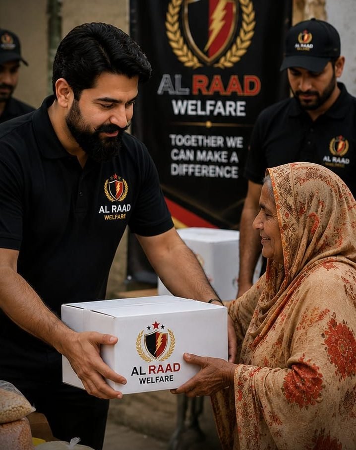 Al Raad Welfare volunteer distributing a food package to a community member